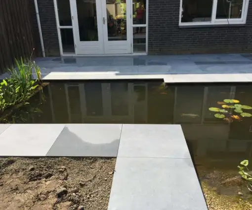 images/001-tuinaanleg-ettenleur/002gerrit-de-jong/Keramische-buitentegels-leggen-Amsterdam-510x424-091
